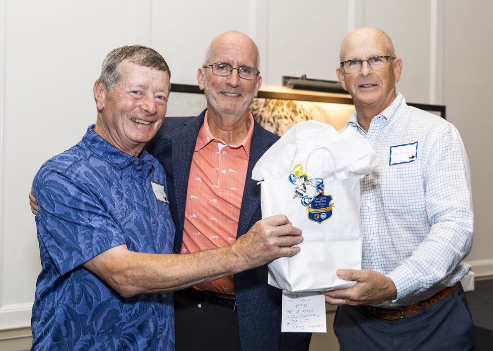Mike Powers accepting award from Mayor Pounds and Ted Kinghorn