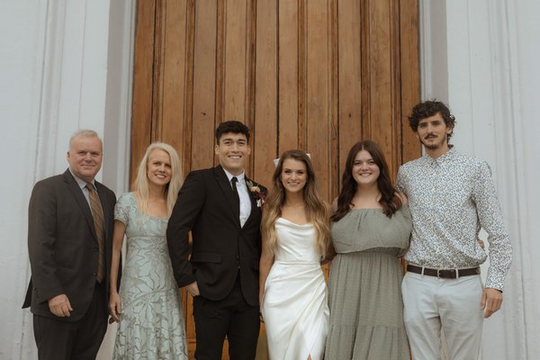 Julie's family, her husband Tim and daughters with husbands (1).png