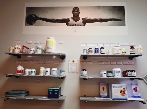 wall of supplements and medicine inside the shop.JPG